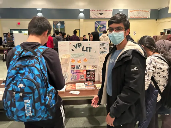Student showcasing the Literature Club during the Club Carousel.