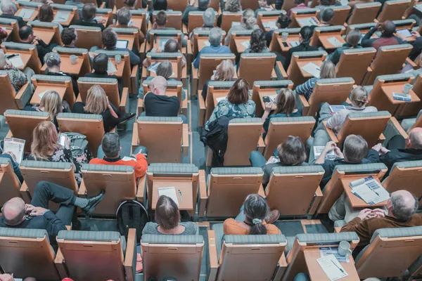  University students sitting in a lecture hall 