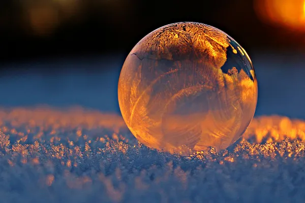 Clear Glass Sphere Outside in the Snow with Snowflake Effect