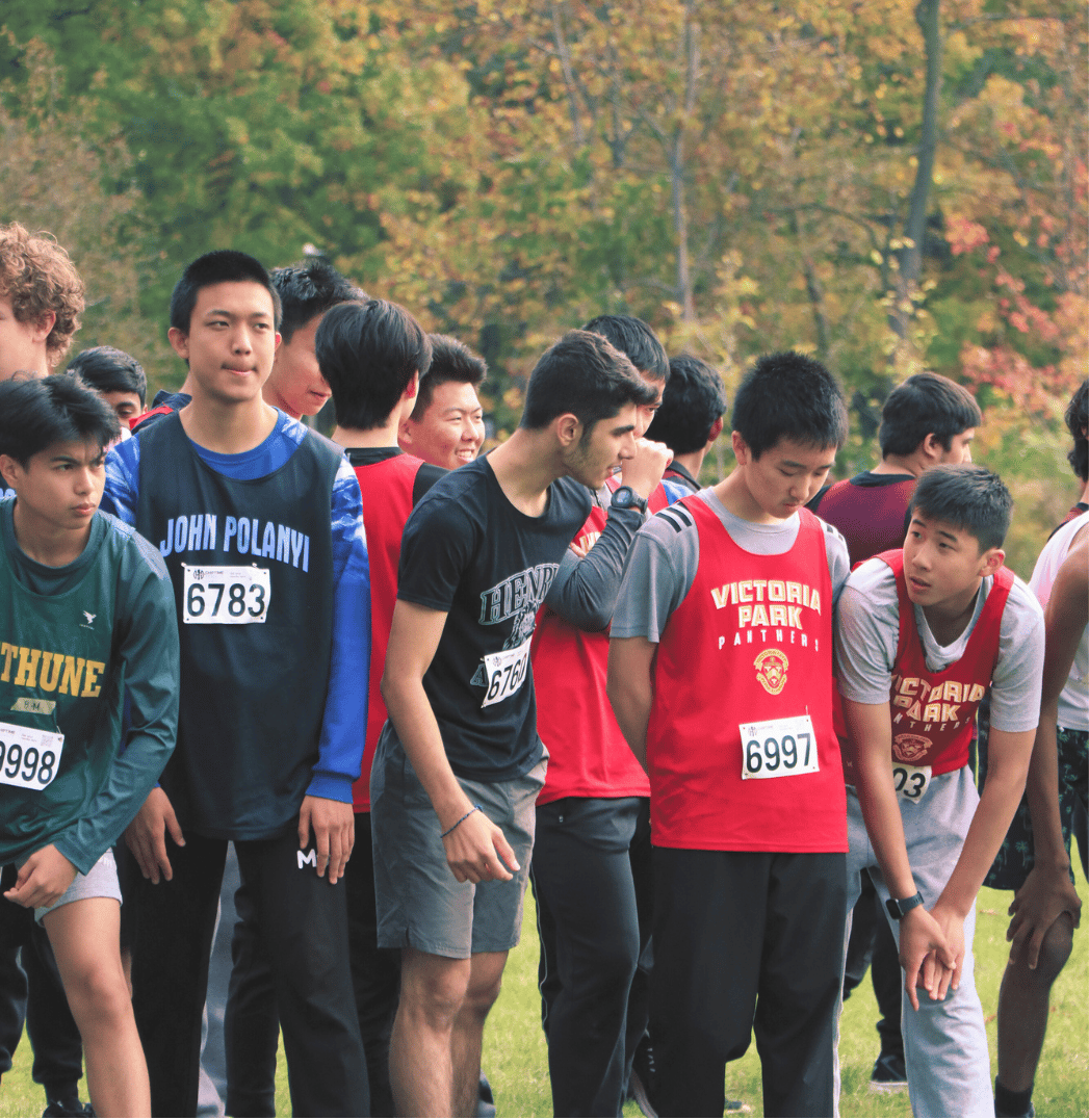 A group of boys preparing to run.